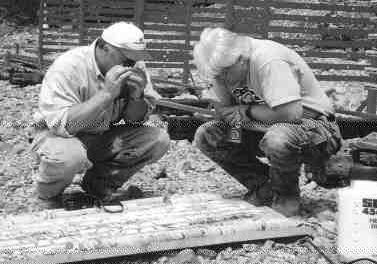 Project Manager George Murphy and Glenn Lutes, geological consultant, examine core from the Central zone.