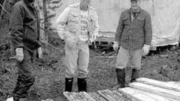 Tyson Birkett, a representative of Soquem, Brooke Clements, Ashton's vice-president of exploration, and Robert Lucas, project manager of Ashton Quebec, stand near drill core samples from the Otish Mountains.