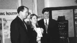 At the Cordilleran Roundup, Robert Stanlake, vice-president of business development for Amec Simons Mining & Metals, stands with Gloria Cameron of the British Columbia Children's Hospital Foundation, and James Excell, president of the Ekati Diamond mine in the Northwest Territories. A diamond from the mine, set in gold and valued at $14,000, will be raffled to raise money for the B.C. Children's Hospital. Story, page 5.