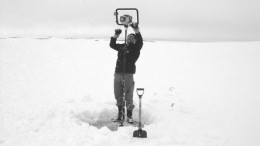 Diamonds North's Dean Mason, camp manager at the Blue Ice diamond project on Victoria Island, Nunavut, augers through ice to find water for winter drilling.