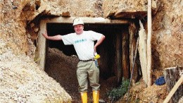 Business News Americas Correspondent David Roberts stands at the entrance to an adit on Greystar Resources' Angostura property in Colombia.