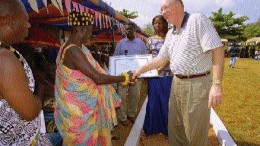 Newmont Mining Chairman and CEO Wayne Murdy greets the locals in Ghana, where the company is developing its multi-million-ounce Ahafo and Akyem gold projects.
