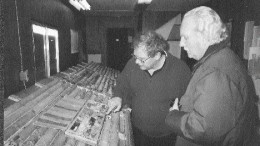 Wayne Reid, St. Andrew Goldfields' exploration manager, and Ellsworth Dickson of Resource World Magazine examine drill core at the Stock Mine east of Timmins.