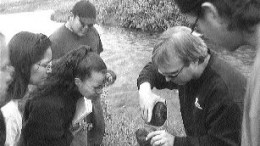 A Golder Associates employee teaches members of First Nations about environmental issues.