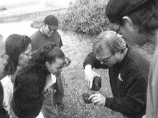 A Golder Associates employee teaches members of First Nations about environmental issues.