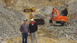 Canadian Arrow Mines Vice President of Exploration Paul Davis (left) and President David Larche stand in front of the bulk sampling operations at the Alexo Nickel property northeast of Timmins, Ont.