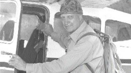 Lew Parres boards a float plane in northern Manitoba.