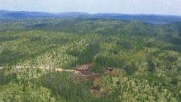 Aerial photo of bulk-sample core drilling into Ashton Mining of Canada's Renard 3 kimberlite. Inset: The three largest diamonds from the Renard 3 results announced in late January. Beginning at the top right and moving clockwise, the diamonds weigh 4.3 carats, 2.7 carats, and 2.29 carats.