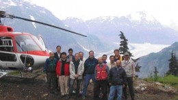 Front row, second from left, Zijin Mining Group Chairman Chen Jing He, on his left is Pinnacle Mines President and CEO Andrew Bowering, followed by Pinnacle Mines Chairman Paul Saxton. Pinnacle Director Bradford Cooke is on the far right (with cap). The officers of both companies visited the Silver Coin gold-silver-base metal project, near Stewart, in northwestern B.C.