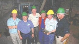 Photo by James WhyteCentury Mining staff display a newly poured dor bar from Sigma, from left: Exploration Geologist Erika Shepherd, Chief Operating Officer Michael Werner, Vice-President Graham Eacott, President Margaret Kent, General Manager Jean-Luc Chouinard, and Vice-President Adrian McNutt.