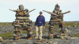 Diamonds North exploration geologist Dale Mah stands between two Inukshuks, an Inuit word meaning "likeness of a person," on the company's 14,500-sq.-km Hepburn diamond property in the Northwest Territories, 300 km north of Yellowknife on the western margin of the Slave craton. Senior Staff Writer Rob Robertson looks at diamond exploration activity in Canada's Far North.