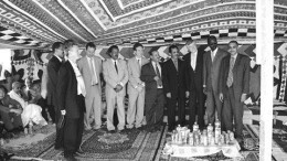 All smiles, no alcohol: Rio Narcea Gold Mines management and government officials gather under a tent in the Sahara desert to celebrate the beginning of construction at the Tasiast gold project in Mauritania.