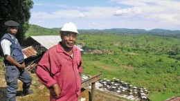 Photo by Anthony VaccaroMoto Goldmines geologist Guillaume Kiza overlooks a gold-rich valley in the northeastern Democratic Republic of the Congo. Nearby, a member of a government-sanctioned private police force acts as security -- a quiet reminder that danger is never far off in the developing world. In our 4-page feature on Mining in Africa, staff writer Anthony Vaccaro talks with a company that helps junior exploration companies like Moto decide to move forward or simply walk away.