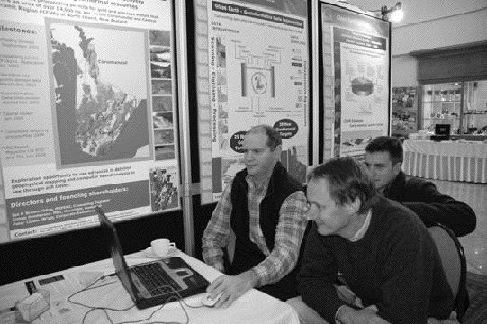 Glass Earth's vice-president of exploration and COO, Simon Henderson (left), shows details of an airborne surveying program to the head of Geology Department head of Auckland University, Jeff Mauk.