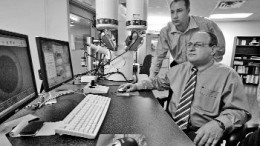 SGS-LAKEFIELDMineral and metallurgical lab SGS-Lakefield recently opened a new facility in Lakefield, Ont., as part of what the company calls its Advanced Mineralogy Network. Here, Paul Gottlieb (front), developer of the QEMSCAN mineralogical analysis instrument -- the cornerstone of the Advanced Mineralogy Network -- demonstrates QEMSCAN with Chris Gunning, an SGS mineralogist.