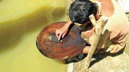 MINDORO RESOURCESOne of many local gold panners on Mindoro Resources' Agata project area in northern Mindanao, Philippines. The company believes that allowing the locals to continue gold panning is good for community relations.