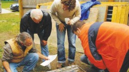 BY JAMES WHYTEBob Mann (kneeling) of Aquila Resources shows core taken from the Back Forty massive sulphide project on Michigan's Upper Peninsula.