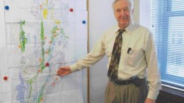 BY STEPHEN STAKIWGGL Diamond president and CEO Ray Hrkac shows the recent Geological Survey of Canada map indicating favourable rocks for a potential nickel belt on its Winter Lake project area north-northeast of Yellowknife, N.W.T.