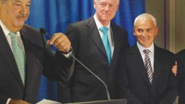WILLIAM J. CLINTON FOUNDATIONFormer U.S. president Bill Clinton gives Endeavour Capital's former chairman Frank Giustra a hug during a ceremony in New York City announcing Giustra and Mexican telecommunications tycoon Carlos Slim's respective US$100-million donations to the William J. Clinton Foundation, a global charity.