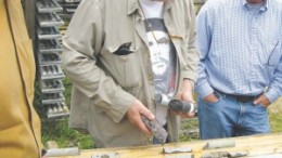 Gordon McRoberts (centre), Augen Gold's project geologist, examines drill-core from the Jerome Mine gold-molybdenum property in northern Ontario.