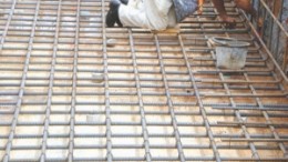 A worker lays the foundations for the mill at Infinito Gold's Crucitas gold project in Costa Rica. Environmental concerns at the project have forced the company to stop construction.