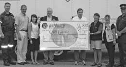 Presenting the Goldcorp cheque to the CNIB Eye Van staff in Red Lake, from left: Ted Turgeon, NW EMS Red Lake ambulance coordinator; Dr. El-Defrawy, Eye Van ophthalmologist; Natasha Marlow, Eye Van staff; John Whitton, community relations officer at Red Lake Gold Mines; Mike Lalonde, Red Lake mine general manager; Darla Pfahler, Eye Van staff; Toots Everley, Red Lake Lions Club; and Rob Monk, Ontario Provincial Police sergeant.