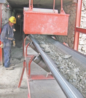 A conveyor wisks feed from the grizzly to the grinder at Impact Silver's Zacualapan silver-lead-zinc mine in Mexico.