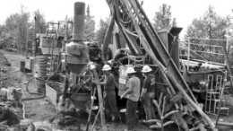 Workers operate a drill rig at International Tower Hill Mines' Livengood gold project north of Fairbanks, Alaska.