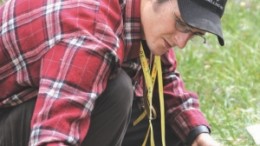 Geologist Adam Kojos examines cores from Atac Resources' Rau project.