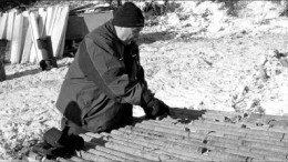 Pacific North West Capital director John Londry looks at core at the River Valley PGM project in northern Ontario. Photo by Pacific North West Capital