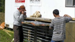 Geologists Bob Marvin (left) and Shane Hu examine core at Bayfield Ventures' Burns Block gold project in northwestern Ontario. Photo by Bayfield Ventures