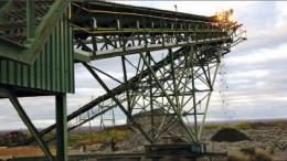 A conveyor discharging ore onto a stockpile at Caledonia Mining's Blanket gold mine in southwest Zimbabwe. Photo by Caledonia Mining