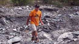 Energizer Resources' senior VP of operations Craig Scherba walks on a giant graphite ridge on the Seta graphite zone at the Green Giant vanadium-graphite project in Madagascar. Photo by Energizer Resources