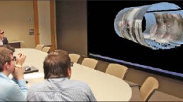 Guests view a presentation at Golder Associates and Mirarco's Collaborative 3D Centre in Toronto. Photo by Golder Associates