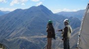 The company's manager of community relations Karina Yavar (left) talks to a geologist at the Bob 1 camp site in Peru.