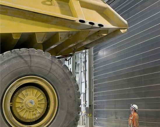 A dump truck dwarfs a worker at Detour Gold's Detour Lake gold mine in northeast Ontario. Credit: Detour Gold