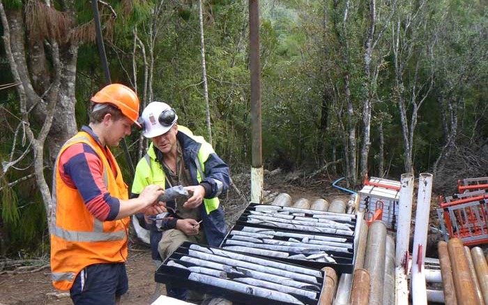Geologists reviewing core at Antipodes Gold's WKP gold project in New Zealand. Credit: Antipodes Gold