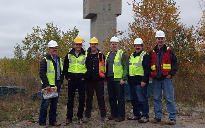 At Pure Gold Mining's historic Madsen gold property in northwestern Ontario, from left: Darin Labrenz, president and CEO; Blaine Monaghan, director of investor relations; Phil Smerchanski, director of geoscience; Sean Tetzlaff, CFO; Lenard Boggio, director; and Darren O'Brien, vice-president of exploration. Photo by Matthew Keevil.