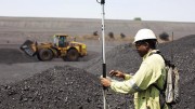 A surveyor measures a coal stockpile at Anglo American's Greenside thermal coal mine in South Africa. Credit: Anglo American