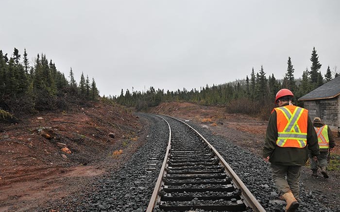 Workers near a railway at Labrador Iron Mines' Schefferville iron ore property in the Labrador Trough. Credit: Labrador Iron Mines