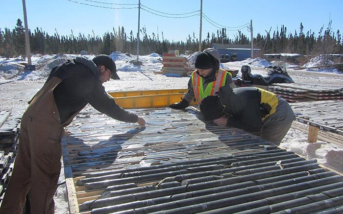 Mega Precious Metals personnel review core samples at the Monument bay gold-tungsten project, 340 km southeast of Thompson, Manitoba. Credit:  Mega Precious Metals