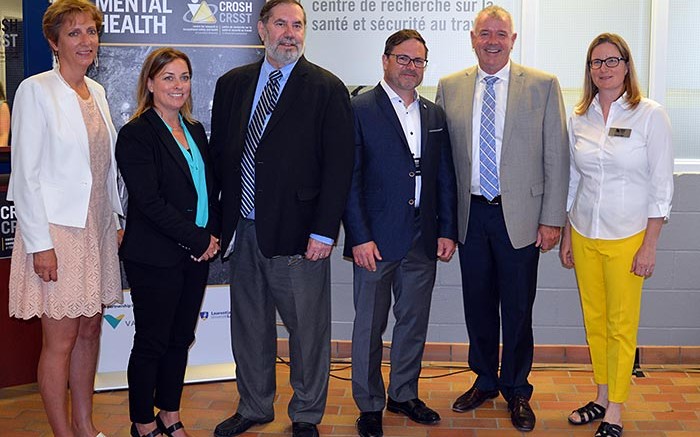 At the announcement event for the mental health in mining research project in Sudbury, from left: France Glinas, MPP for Nickel Belt; Jody Kuzenko,director of Vale's Ontario production services; Leo Gerard, international president of the United Steelworkers; Michel Larivire, clinical psychologist and associate director at CROSH; Kevin Daniel Flynn, Ontario Minister of Labour; and Tammy Eger, research chair in occupational health and safety. Source: Laurentian University