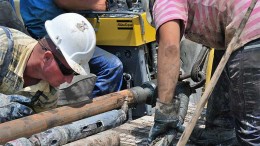 Workers at the Cukaru Peki drilling site. Source: Reservoir Minerals