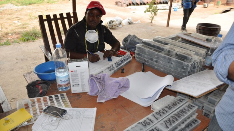 A worker logs chip samples at Avnel Gold’s Kalana gold project in West Africa. Credit: Avnel Gold.