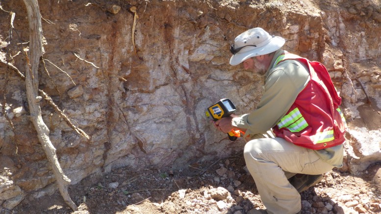 Geologist Dale Brittliffe collects data with a handheld XRF unit at an outcrop on Orex Minerals and Canasil Resources’ Sandra Escobar silver project in Durango state, Mexico. Photo by Ben Whiting.