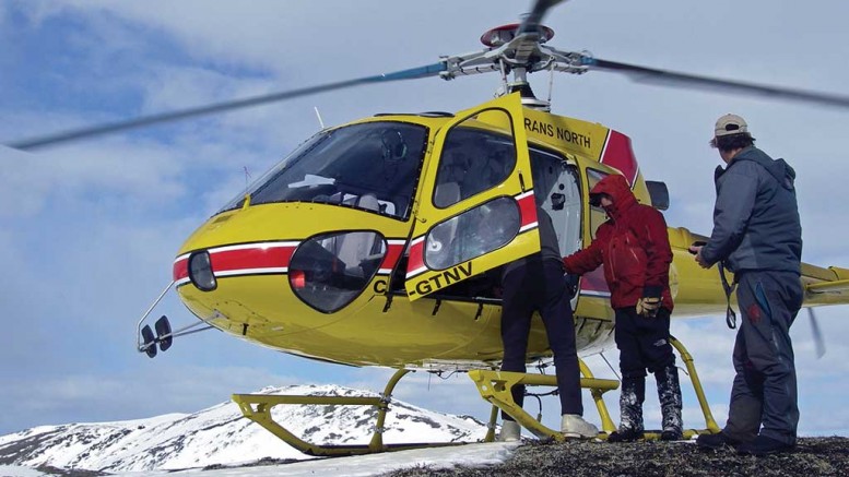 Shawn Ryan (far right) carrying early spring staking in the Yukon. Photo by Shawn Ryan.