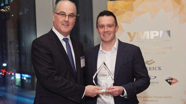 Peter Sinclair (left), chief sustainability officer at Barrick Gold, presents Nolan Watson, president and CEO of Sandstorm Gold, with the Young Mining Professionals’ Peter Munk Award for 2016.  Credit: YMP.