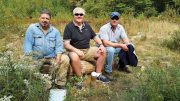 At the Pine Zone discovery hole on New Age Metal’s River Valley PGM property in northern Ontario, from left: Richard Zemoroz, project geologist; Harry Barr, founder, chairman and CEO; and Trevor Richardson, president and COO. Photo by Trish Saywell.