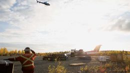 A helicopter above the airstrip at Nighthawk Gold’s Indin Lake gold project in the Northwest Territories. Credit: Nighthawk Gold.