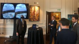 Matthew Keevil (left), vice-president of corporate affairs at Atac Resources, tries on VRify's 3D visualization technology at the Canadian Mining Symposium in London in April 2018, as Atac president and CEO Graham Downs looks on. Credit: VRify twitter.